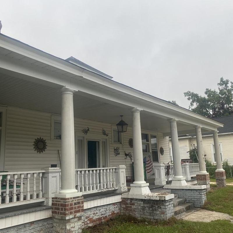 Front porch columns and railings with brick bases