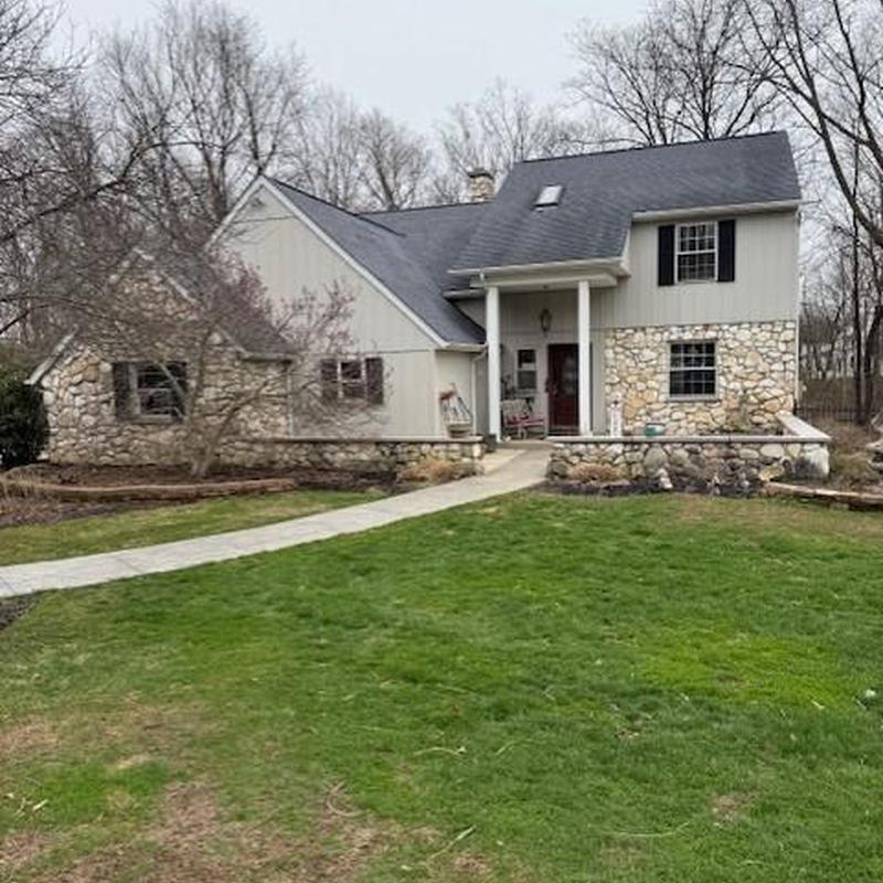 Asphalt shingle roof with stone and siding exterior Asphalt shingle roof with stone and siding exterior