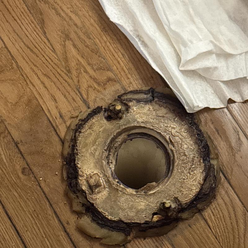 Toilet flange corrosion and base leak on hardwood floor