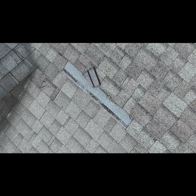 Roof shingles with damaged and missing pieces