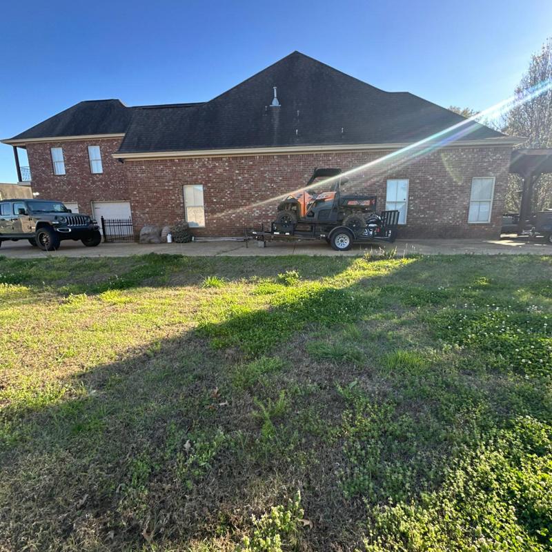 Asphalt shingle roof on brick house with inspection equipment