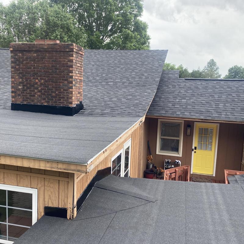 IKO Dynasty Granite Black shingle roof with flat roof section IKO Dynasty Granite Black shingle roof with flat roof section
