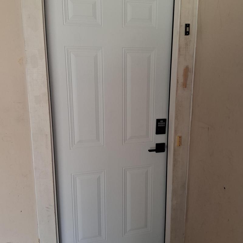 Exterior door with electronic keypad lock installed