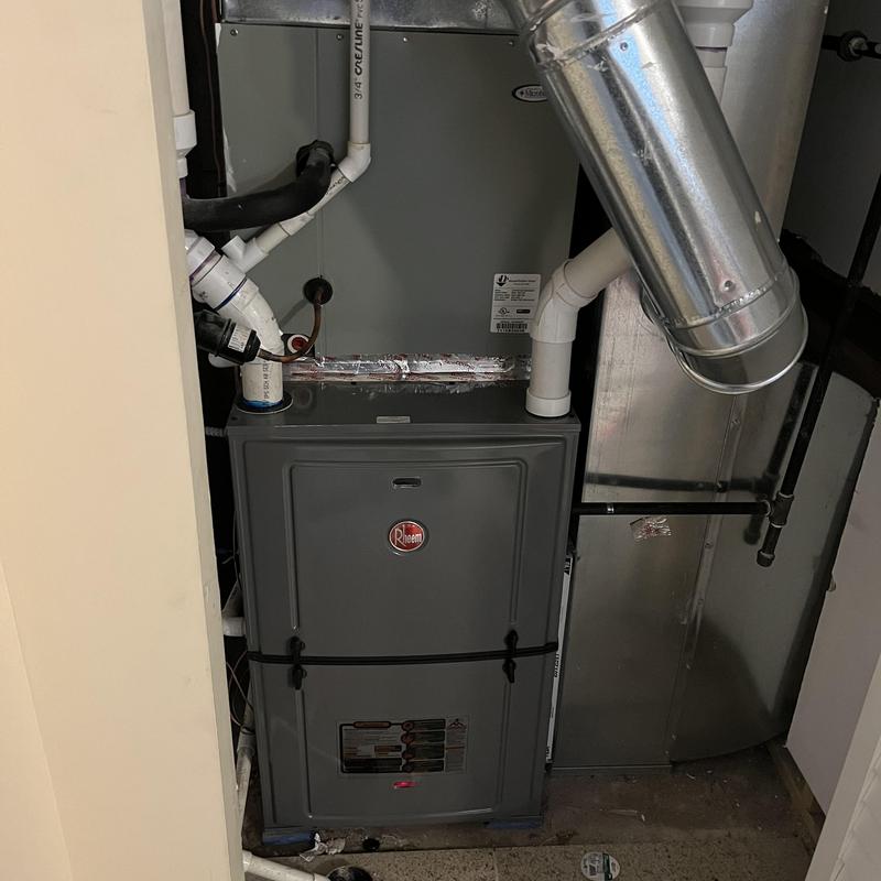 Rheem high-efficiency gas furnace installation in closet