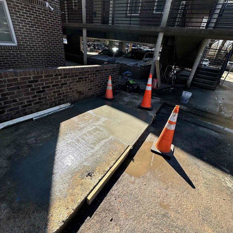 Concrete surface restoration with safety cones and excavation Concrete surface restoration with safety cones and excavation