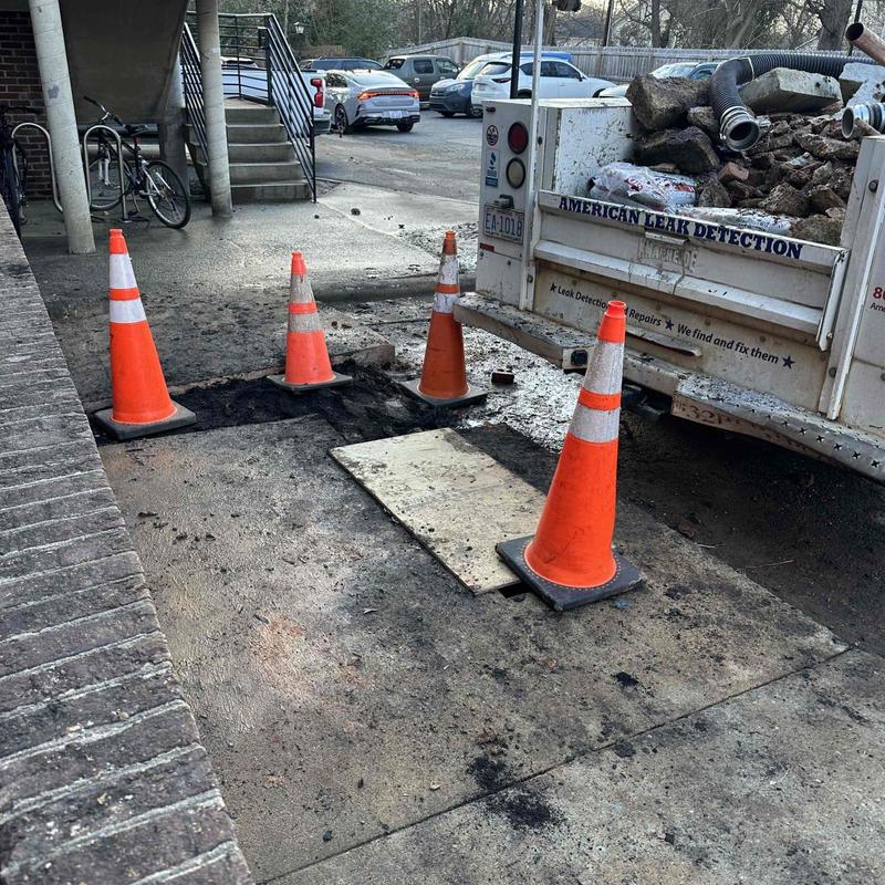 Underground PVC pipe with excavation and safety cones Underground PVC pipe with excavation and safety cones