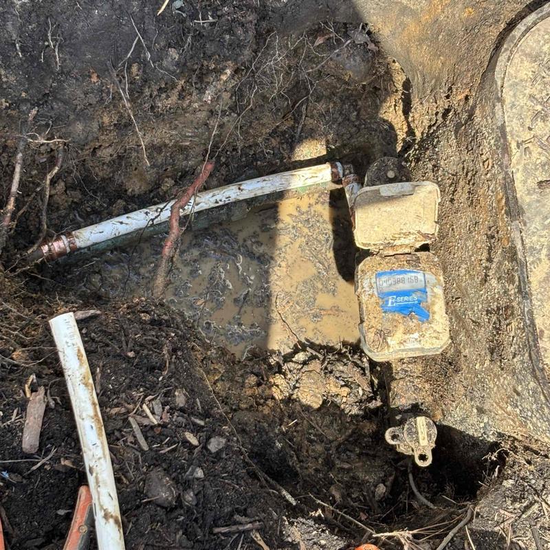 Water meter and corroded copper pipe excavation site Water meter and corroded copper pipe excavation site