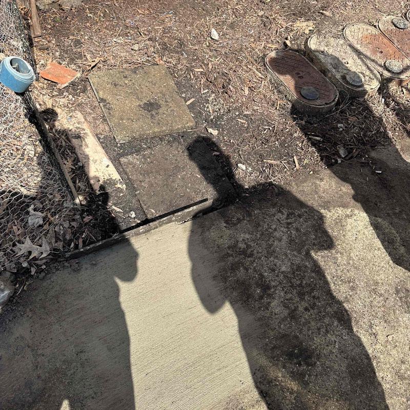 Concrete patch and water meter area excavation shadows Concrete patch and water meter area excavation shadows