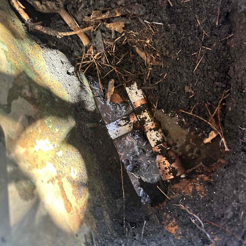 Cracked PVC pipe fittings exposed in soil excavation Cracked PVC pipe fittings exposed in soil excavation