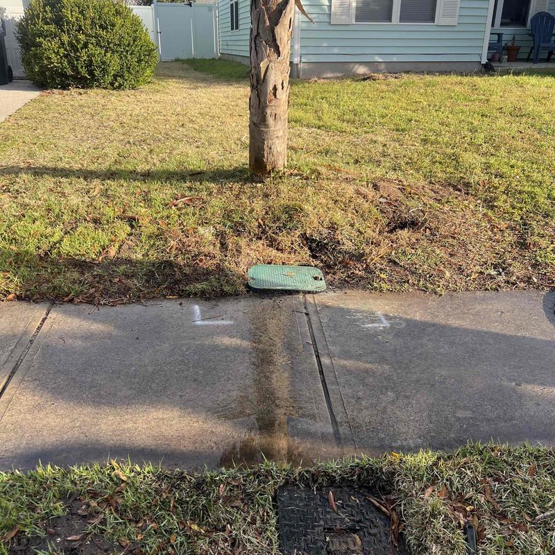 PVC underground piping access with green valve cover PVC underground piping access with green valve cover