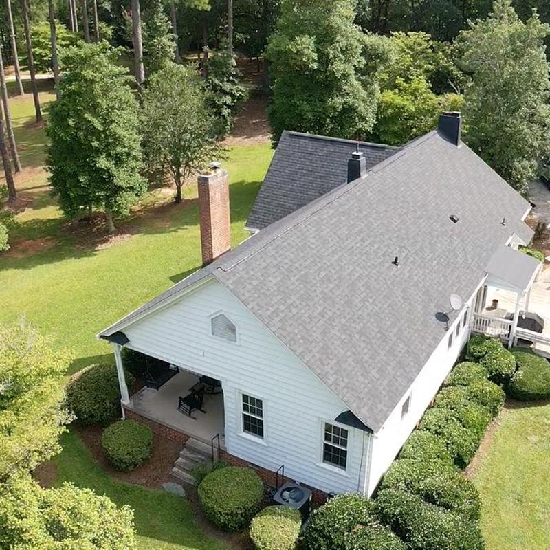 Owens Corning Onyx Black shingle roof with new gutters