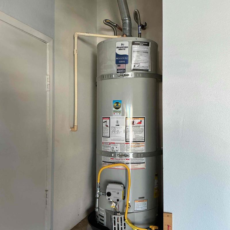 50-gallon water heater installation with gas line connection