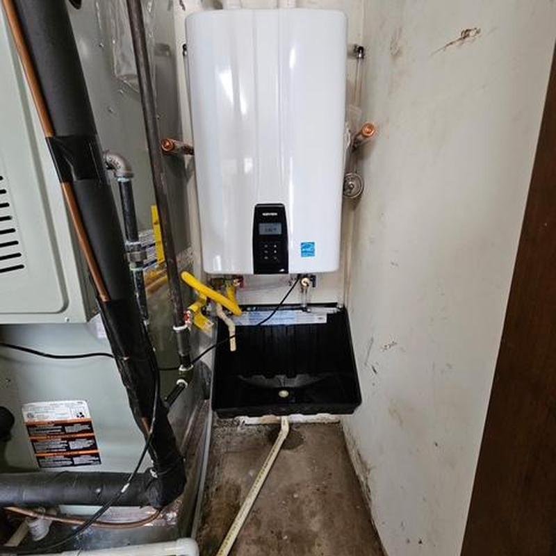 Navien tankless water heater and drain pan installation