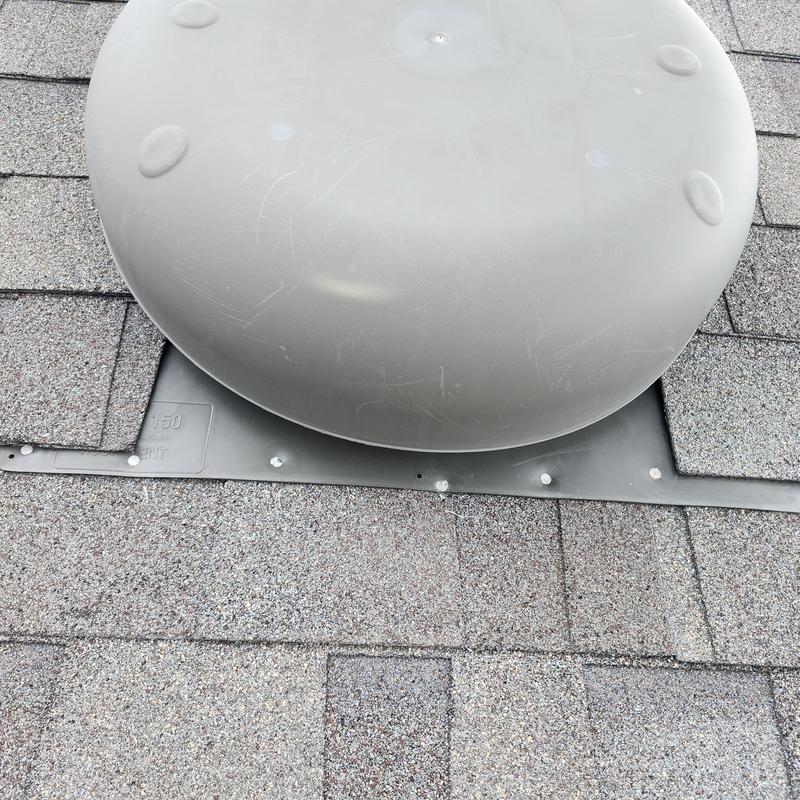 Roof vent flashing with sealed exposed fasteners on shingles