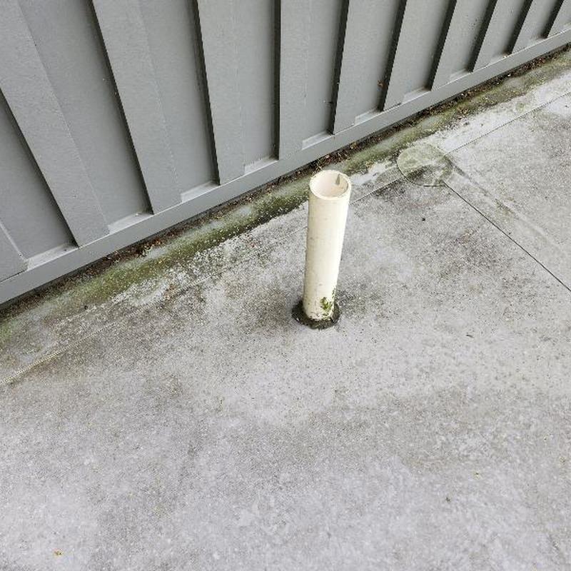 TPO roof with missing plumbing boot and holes