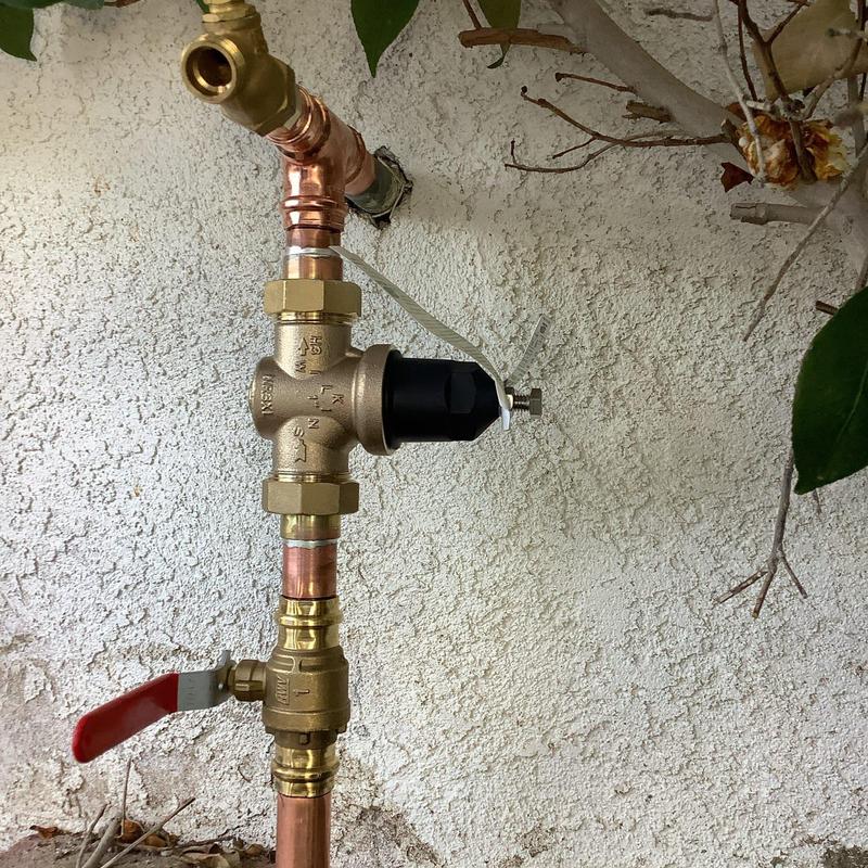 Water service riser with pressure regulator and ball valve