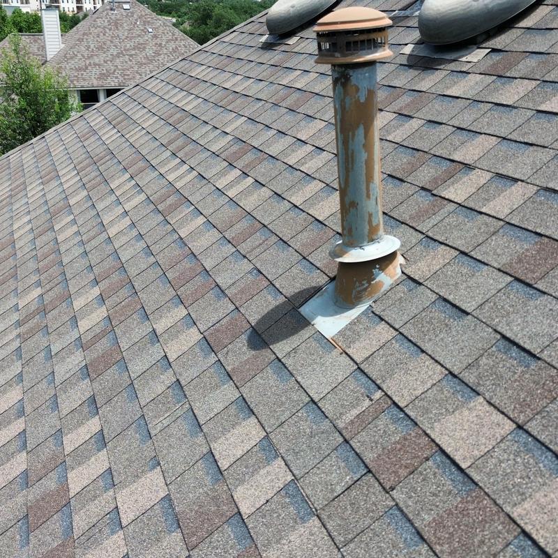 Roof plumbing boot with peeling paint and sealant needed