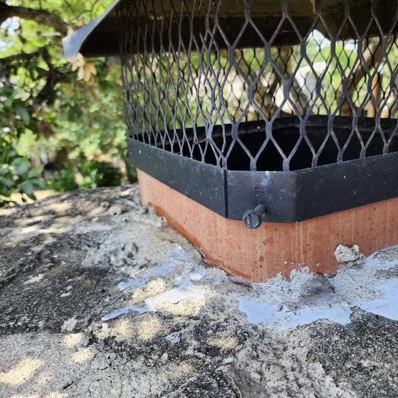 Chimney mortar and flue gap sealed with caulk