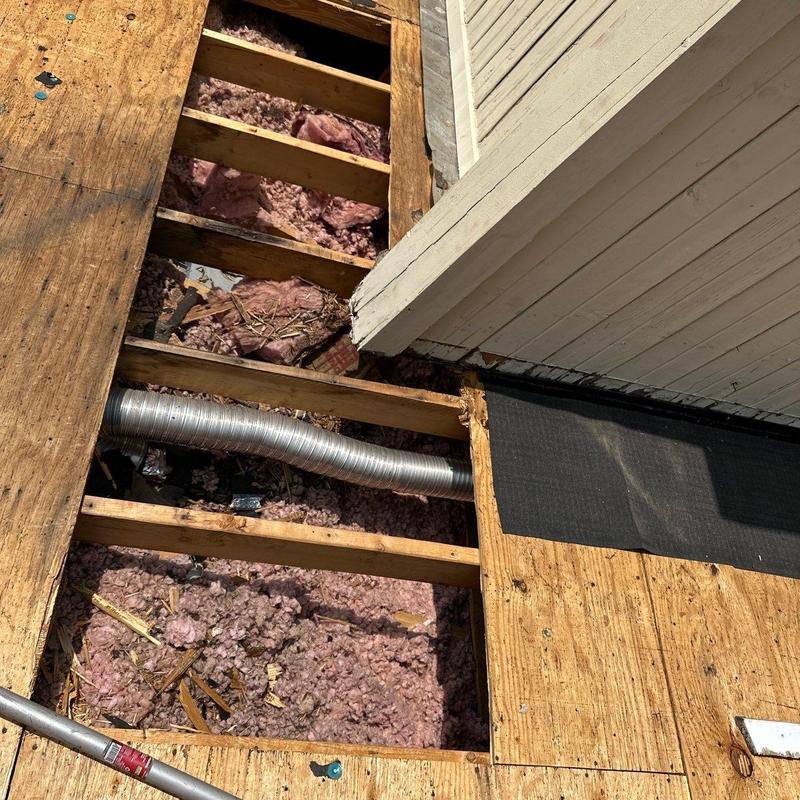 Roof decking with insulation and vent duct exposed Roof decking with insulation and vent duct exposed