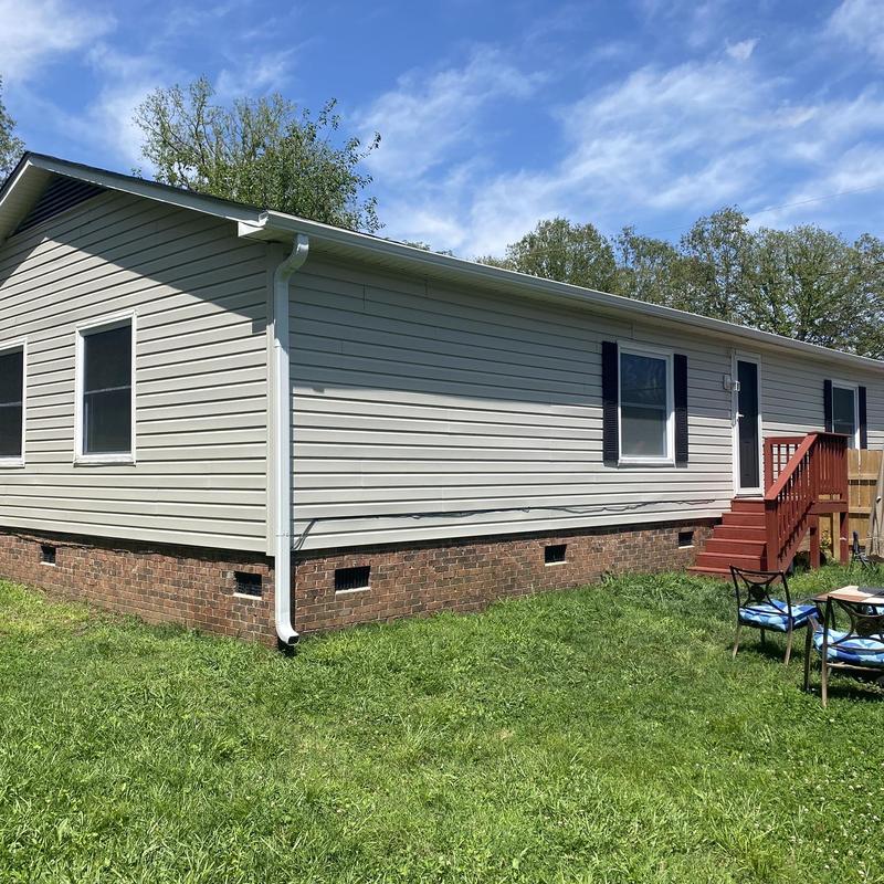 Vinyl siding and gutter system on home exterior Vinyl siding and gutter system on home exterior