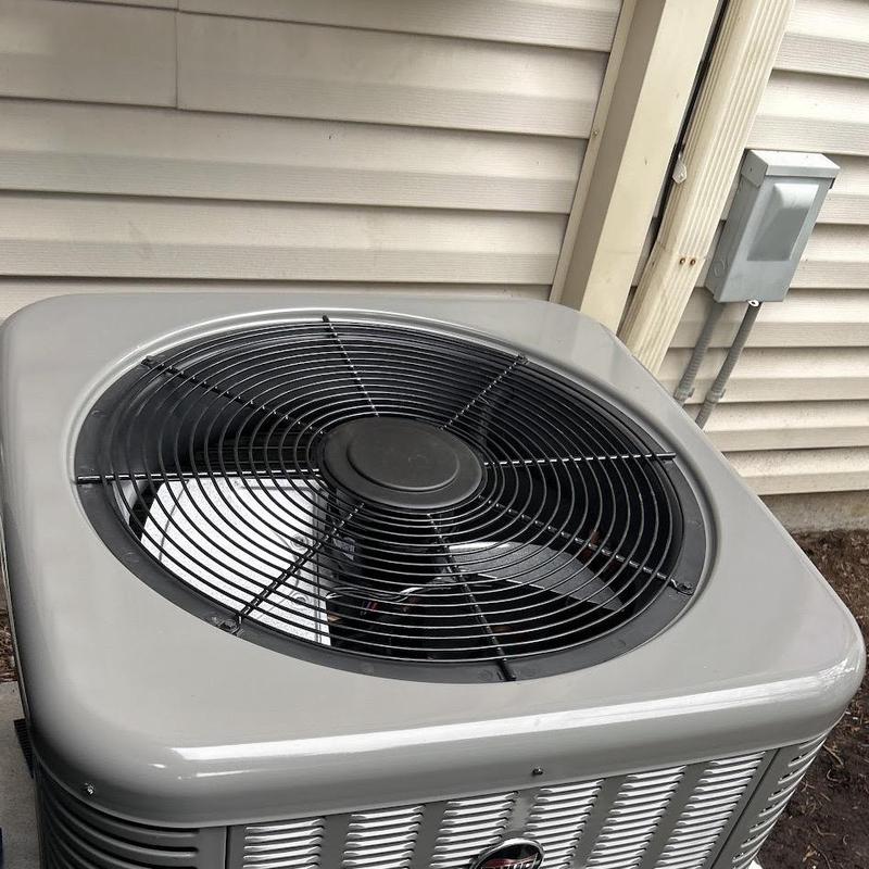 Ruud air conditioning system installed outside home Ruud air conditioning system installed outside home