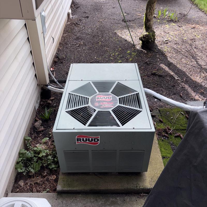 Ruud outdoor air conditioning unit installed outdoors Ruud outdoor air conditioning unit installed outdoors