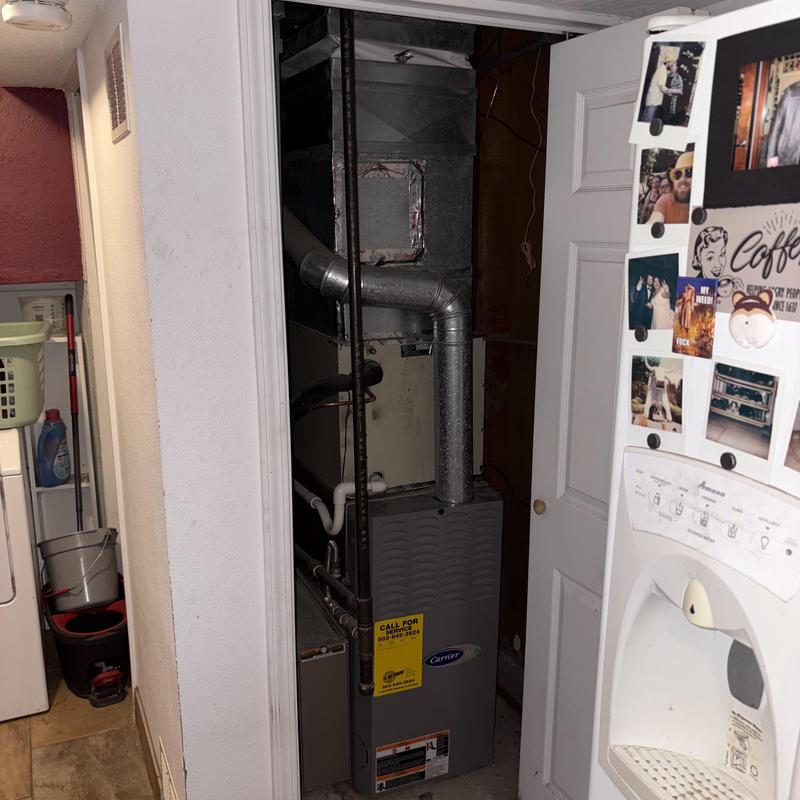 Carrier gas furnace with ductwork in utility closet Carrier gas furnace with ductwork in utility closet