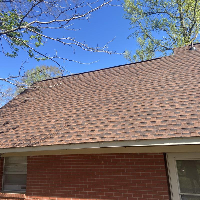 Architectural shingle roof on brick house