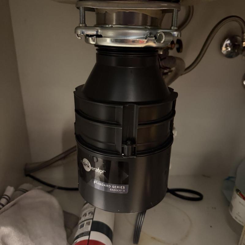 Garbage disposal unit installed under kitchen sink