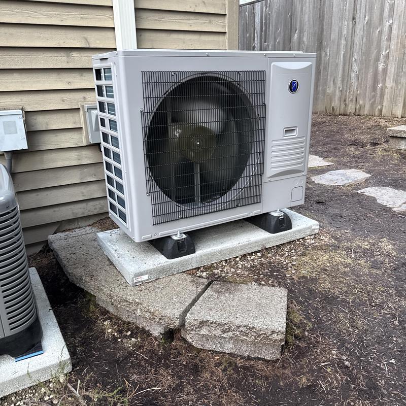Variable speed heat pump installed on concrete pad Variable speed heat pump installed on concrete pad