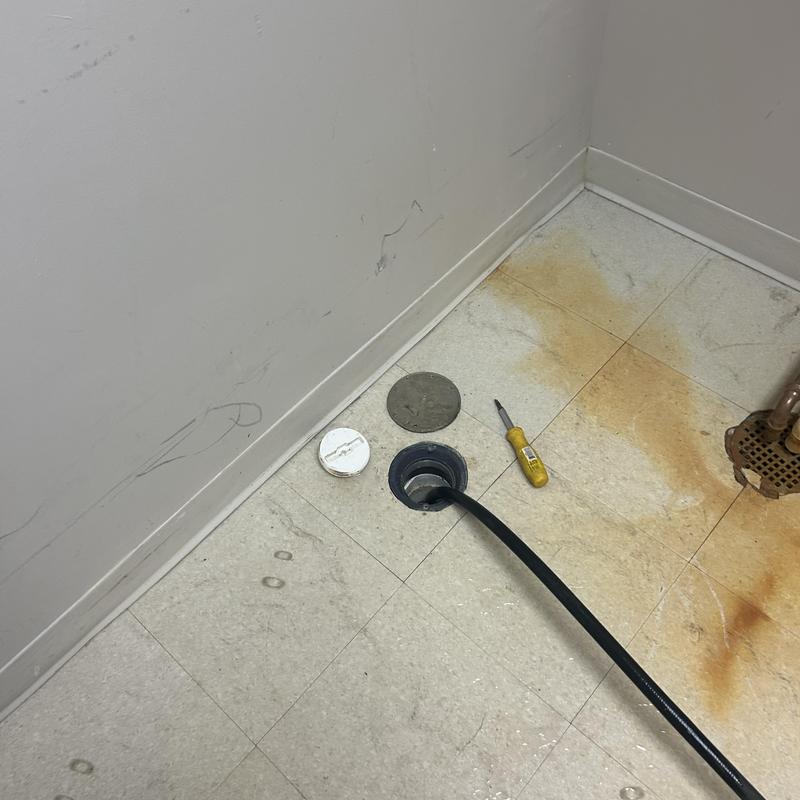 Floor drain with hydro jet cleaning hose and tools Floor drain with hydro jet cleaning hose and tools