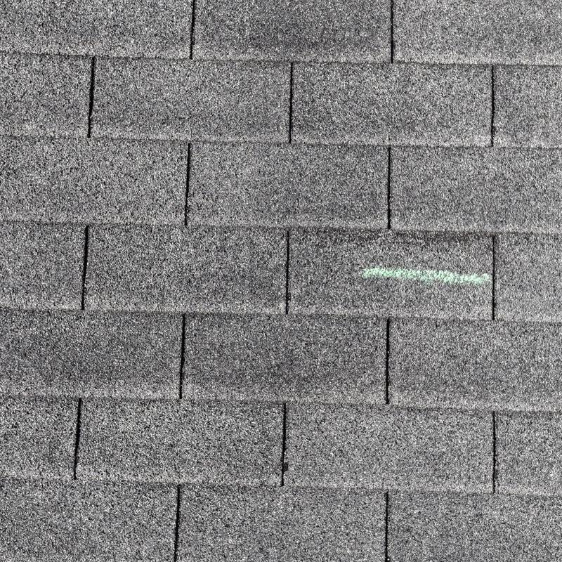 Asphalt roof shingles with chalk marking defect