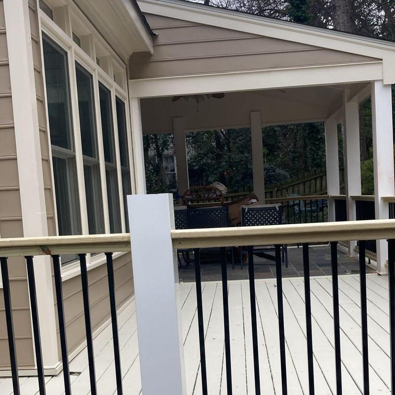 Trex deck railing installation beside covered porch Trex deck railing installation beside covered porch