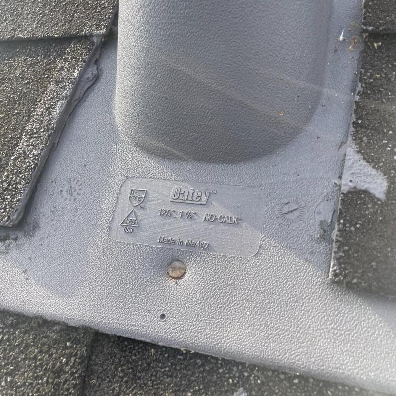 Pipe boot flashing sealed on shingle roof