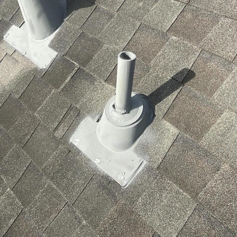 Pipe boot flashing on shingle roof maintenance