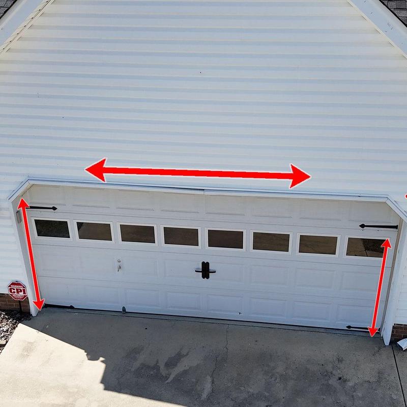 Garage door with measurement arrows on frame and width Garage door with measurement arrows on frame and width