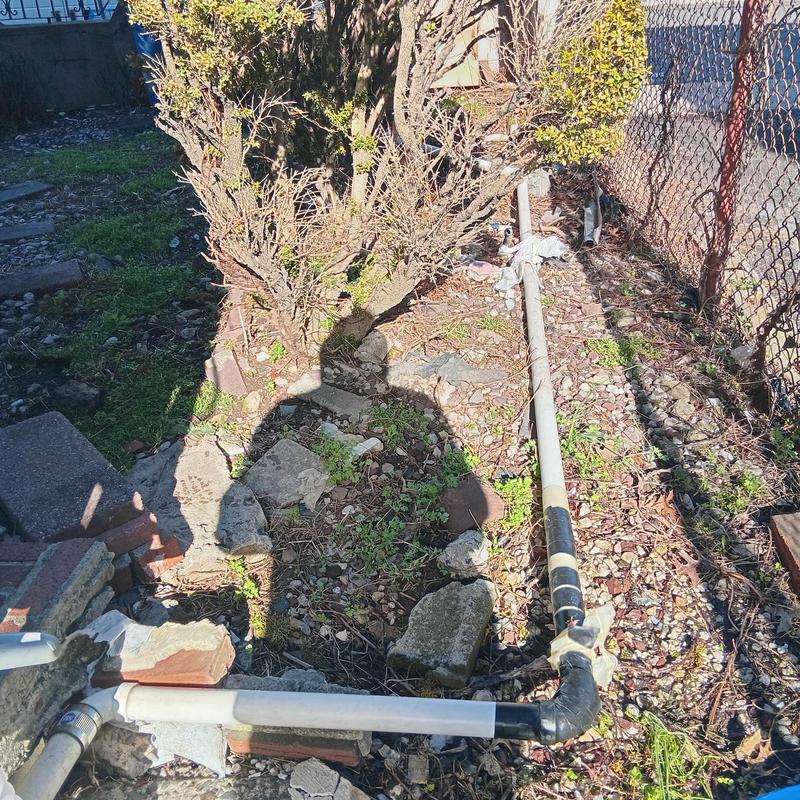 Sewer line camera inspection setup in backyard area Sewer line camera inspection setup in backyard area