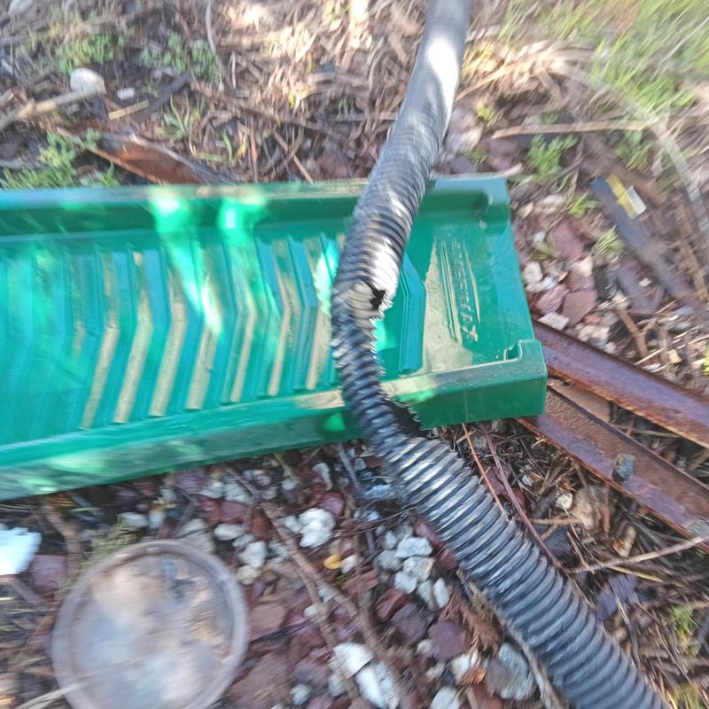 Corrugated drain pipe with visible damage outdoors Corrugated drain pipe with visible damage outdoors