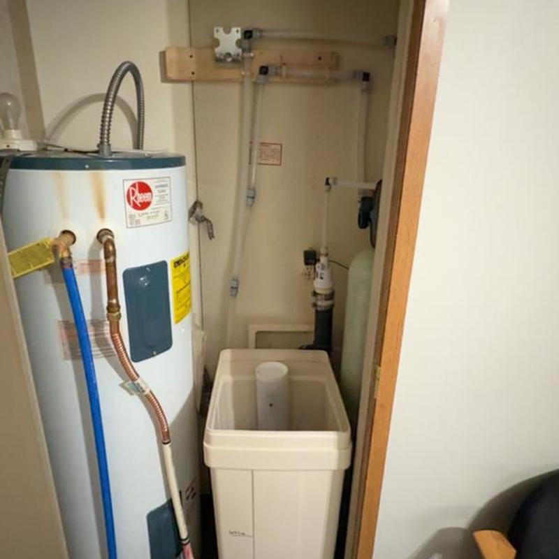 Water softener and water heater installation in utility closet