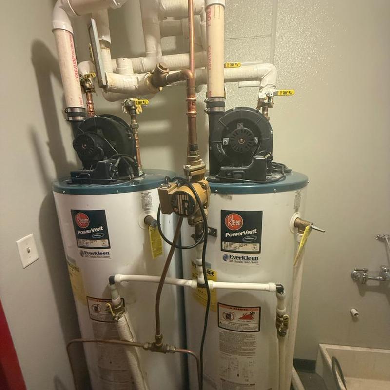 Water heater system with vent fans and piping