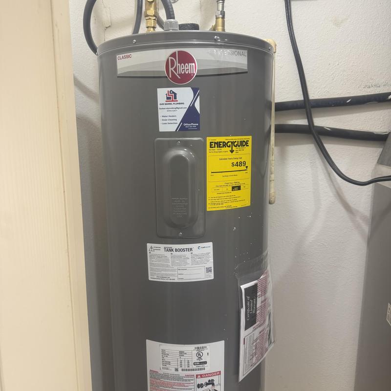 Electric water heater with valves and flex lines installed