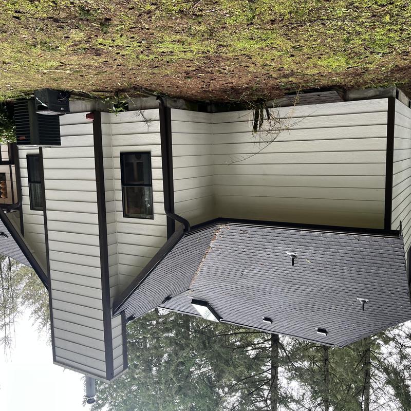 Gutters with clogged guards on residential house