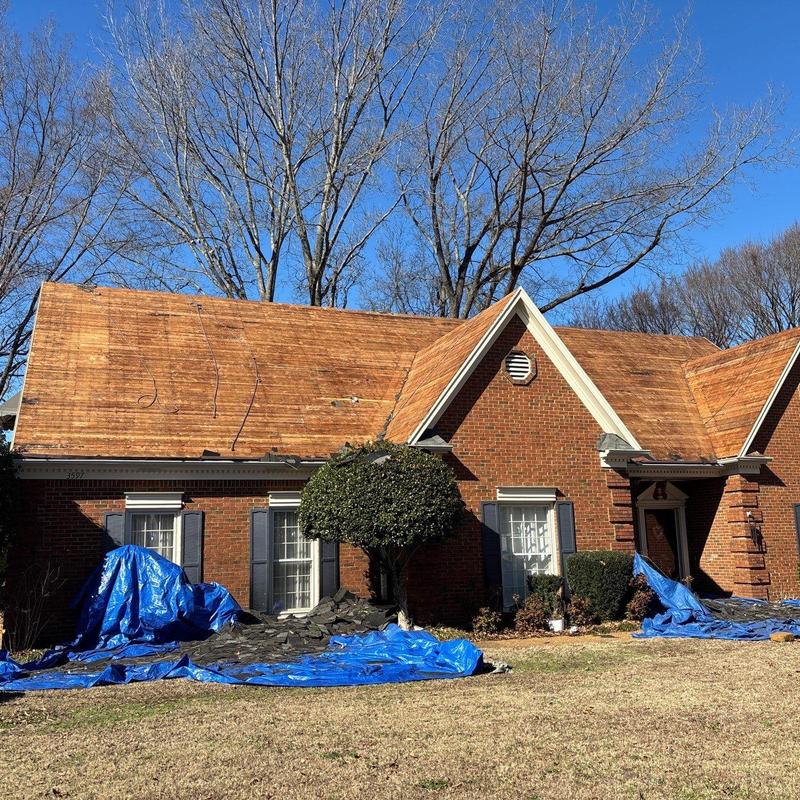 Asphalt roof stripped for storm damage replacement