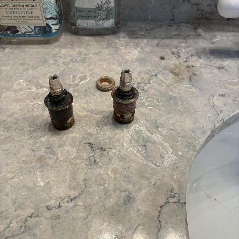 Basin faucet hot and cold stems removed on countertop