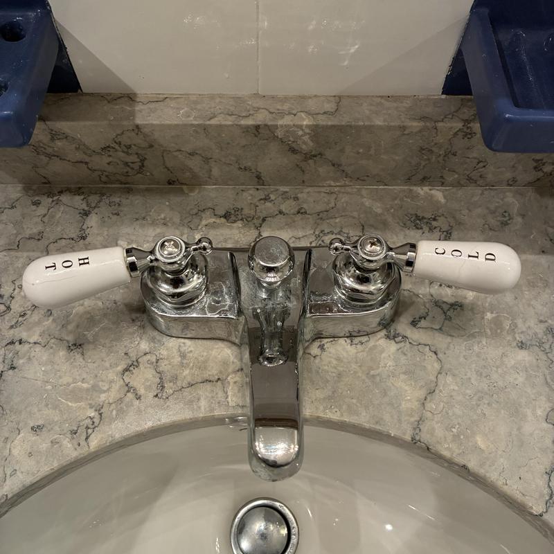 Basin faucet with hot and cold stem handles