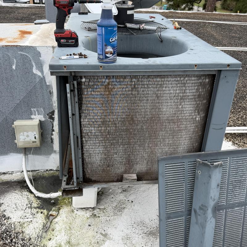 Condenser coil leak patch with tools on rooftop unit Condenser coil leak patch with tools on rooftop unit