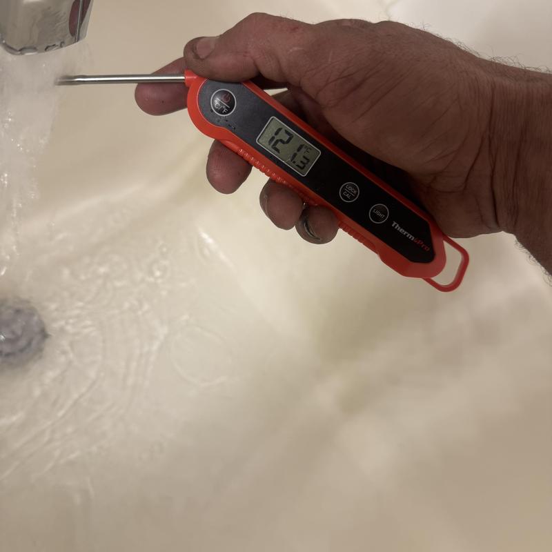 Water heater temperature check with digital thermometer