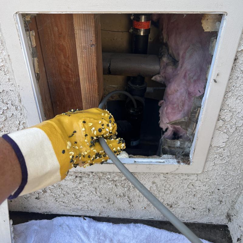 Kitchen drain pipe cleaning with roto-rooter tool