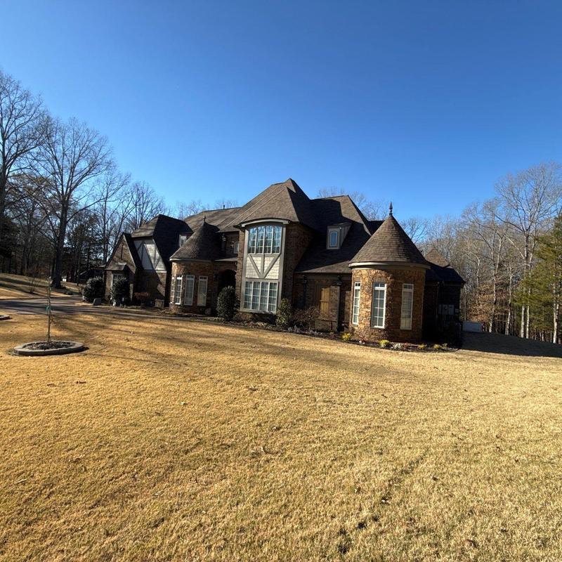 Asphalt shingle roof on large brick home
