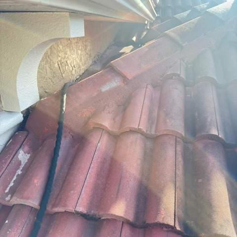 Concrete tile roof leak inspection with water test